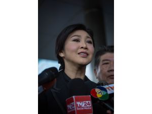 CORRECTS - Thai junta orders ex-PM to pay fine over subsidy scheme